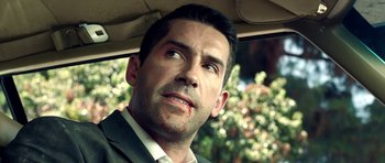 Movie still from “The Debt Collector” (2018), directed by Jesse V. Johnson – A person in a car; Close Up shot, Over the shoulder angle