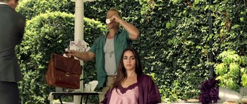 Movie still from “The Debt Collector” (2018), directed by Jesse V. Johnson – A man and a woman sitting in front of each other; Medium shot, Low angle