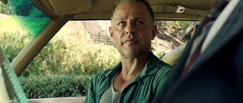 Movie still from “The Debt Collector” (2018), directed by Jesse V. Johnson – A person sitting in a car; Close Up shot, Over the shoulder angle