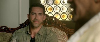 Movie still from “The Debt Collector” (2018), directed by Jesse V. Johnson – A person sitting in a chair; Close Up shot, Over the shoulder angle