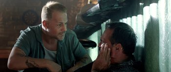 Movie still from “The Debt Collector” (2018), directed by Jesse V. Johnson – Two men talking to each other in front of a mirror; Close Up shot, Over the shoulder angle