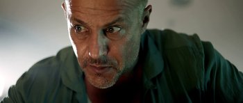 Movie still from “The Debt Collector” (2018), directed by Jesse V. Johnson – A person with a beard; Close Up shot, Low angle