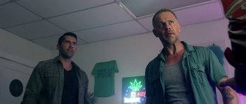 Movie still from “The Debt Collector” (2018), directed by Jesse V. Johnson – A couple of men standing next to each other in a room; Medium shot, Low angle