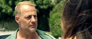 Movie still from “The Debt Collector” (2018), directed by Jesse V. Johnson – A person talking to another person; Close Up shot, Over the shoulder angle