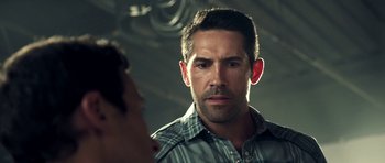 Movie still from “The Debt Collector” (2018), directed by Jesse V. Johnson – A person in a mirror; Close Up shot, Over the shoulder angle