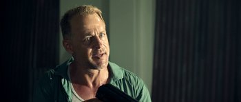 Movie still from “The Debt Collector” (2018), directed by Jesse V. Johnson – A person holding a camera; Close Up shot, Over the shoulder angle