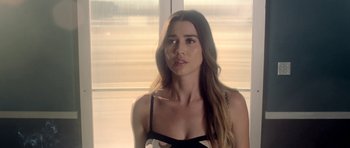 Movie still from “The Debt Collector” (2018), directed by Jesse V. Johnson – A beautiful young woman with long brown hair; Close Up shot, Over the shoulder angle