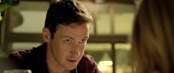 Movie still from “The Debt Collector” (2018), directed by Jesse V. Johnson – A person looking at the camera; Close Up shot, Over the shoulder angle