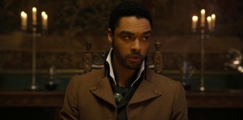 Movie still from “Bridgerton” (2020), created by Chris Van Dusen – A person wearing a suit and tie; Close Up shot, High angle