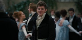 Movie still from “Bridgerton” (2020), created by Chris Van Dusen – A young man in a black jacket and a white shirt; Medium shot, Over the shoulder angle