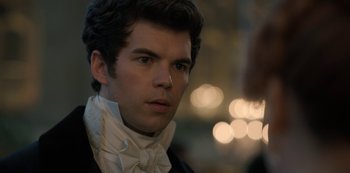 Movie still from “Bridgerton” (2020), created by Chris Van Dusen – A young man wearing a black and white suit; Close Up shot, Over the shoulder angle