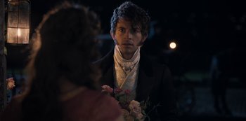 Movie still from “Bridgerton” (2020), created by Chris Van Dusen – A man in a suit holding a bouquet of flowers; Close Up shot, Over the shoulder angle