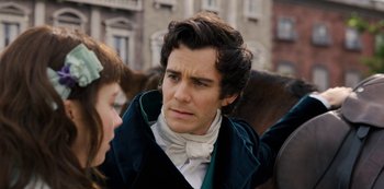 Movie still from “Bridgerton” (2020), created by Chris Van Dusen – A man in a blue jacket and a woman in a white dress; Close Up shot, Over the shoulder angle