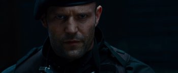 Movie still from “The Expendables” (2010), directed by Sylvester Stallone – A person wearing a hat; Close Up shot, Low angle