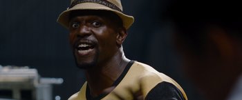 Movie still from “The Expendables” (2010), directed by Sylvester Stallone – A person wearing a hat; Close Up shot, Low angle