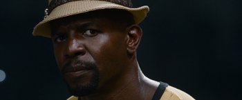 Movie still from “The Expendables” (2010), directed by Sylvester Stallone – A man wearing a hat; Close Up shot, Low angle