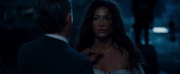 Movie still from “The Expendables” (2010), directed by Sylvester Stallone – A man and a woman looking into a mirror; Close Up shot, Over the shoulder angle