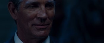 Movie still from “The Expendables” (2010), directed by Sylvester Stallone – A man's face in the dark; Close Up shot, Low angle