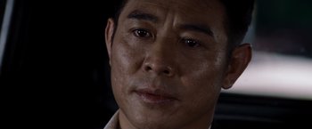 Movie still from “The Expendables” (2010), directed by Sylvester Stallone – A man's face in a dark room; Close Up shot, Low angle