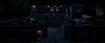 Movie still from “The Expendables” (2010), directed by Sylvester Stallone – An empty street with a lot of trash in it; Extreme Wide shot, High angle