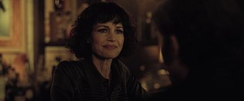 Movie still from “The Fall of the House of Usher” (2023), directed by Mike Flanagan – A person sitting in front of a window; Close Up shot, Over the shoulder angle