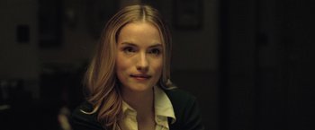 Movie still from “The Fall of the House of Usher” (2023), directed by Mike Flanagan – A beautiful young woman with long blonde hair; Close Up shot, Over the shoulder angle