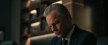 Movie still from “The Fall of the House of Usher” (2023), directed by Mike Flanagan – An older man in a suit and tie looking to his left; Close Up shot, Low angle