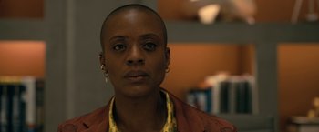 Movie still from “The Fall of the House of Usher” (2023), directed by Mike Flanagan – A person with a bald head; Close Up shot, Low angle