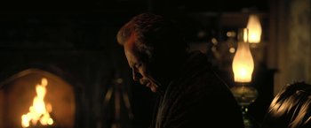 Movie still from “The Fall of the House of Usher” (2023), directed by Mike Flanagan – A man with his head turned to the side; Close Up shot, Low angle
