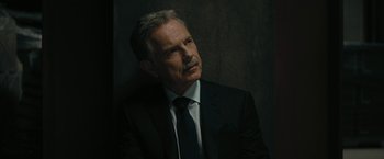 Movie still from “The Fall of the House of Usher” (2023), directed by Mike Flanagan – An older man in a suit and tie looking off into the distance; Close Up shot, High angle