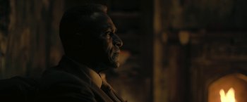 Movie still from “The Fall of the House of Usher” (2023), directed by Mike Flanagan – An older man wearing a suit and a tie; Close Up shot, Over the shoulder angle