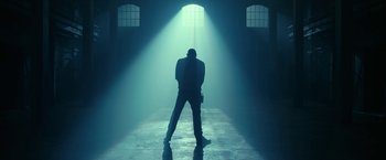 Movie still from “The Fall of the House of Usher” (2023), directed by Mike Flanagan – A man standing in the middle of an empty room; Wide shot, Low angle