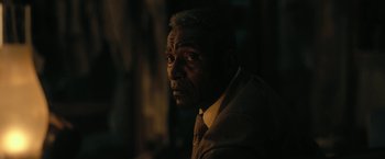 Movie still from “The Fall of the House of Usher” (2023), directed by Mike Flanagan – An older man wearing a suit and a tie; Close Up shot, Over the shoulder angle