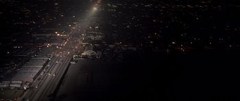 Movie still from “The Fast and the Furious” (2001), directed by Rob Cohen – A view of a city at night from a plane window; Extreme Wide shot, High angle