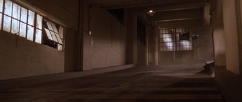 Movie still from “The Fast and the Furious” (2001), directed by Rob Cohen – A dimly - lit room with a large window; Extreme Wide shot, High angle