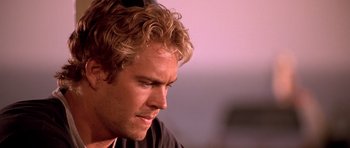 Movie still from “The Fast and the Furious” (2001), directed by Rob Cohen – A person looking down at his face; Close Up shot, Over the shoulder angle