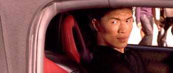 Movie still from “The Fast and the Furious” (2001), directed by Rob Cohen – A person sitting in a car; Close Up shot, Over the shoulder angle