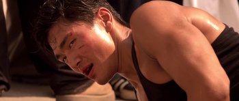 Movie still from “The Fast and the Furious” (2001), directed by Rob Cohen – A person with a bruise on his face; Close Up shot, Low angle