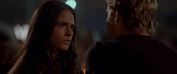 Movie still from “The Fast and the Furious” (2001), directed by Rob Cohen – A woman and a man standing next to each other in the dark; Close Up shot, Over the shoulder angle