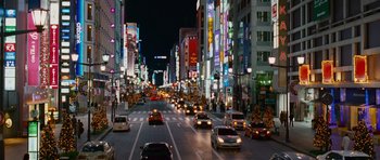 Movie still from “The Fast and the Furious: Tokyo Drift” (2006), directed by Justin Lin – A city street filled with lots of traffic at night; Extreme Wide shot, High angle