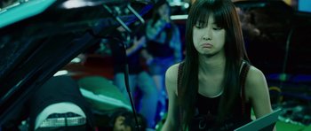 Movie still from “The Fast and the Furious: Tokyo Drift” (2006), directed by Justin Lin – A woman sitting in front of another woman in a car; Medium shot, Over the shoulder angle