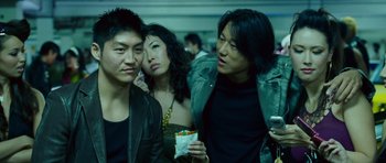 Movie still from “The Fast and the Furious: Tokyo Drift” (2006), directed by Justin Lin – A group of people standing next to each other; Close Up shot, Low angle