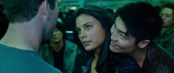 Movie still from “The Fast and the Furious: Tokyo Drift” (2006), directed by Justin Lin – A woman and a man on a train; Close Up shot, Over the shoulder angle