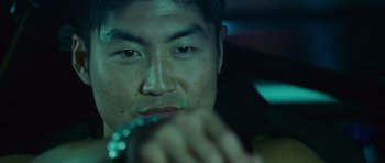Movie still from “The Fast and the Furious: Tokyo Drift” (2006), directed by Justin Lin – A person in a car; Close Up shot, Over the shoulder angle