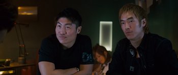 Movie still from “The Fast and the Furious: Tokyo Drift” (2006), directed by Justin Lin – Two men sitting at a table in front of a mirror; Close Up shot, Low angle