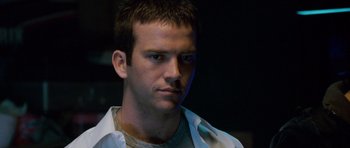 Movie still from “The Fast and the Furious: Tokyo Drift” (2006), directed by Justin Lin – A person wearing a white shirt; Close Up shot, Over the shoulder angle