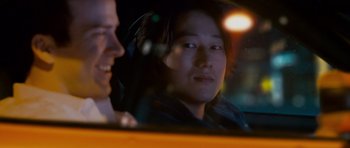 Movie still from “The Fast and the Furious: Tokyo Drift” (2006), directed by Justin Lin – A man in a car looking out the window at another man; Close Up shot, Over the shoulder angle