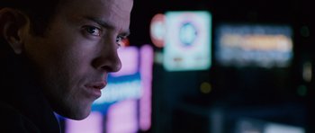 Movie still from “The Fast and the Furious: Tokyo Drift” (2006), directed by Justin Lin – A man's face in front of neon lights; Close Up shot, Over the shoulder angle
