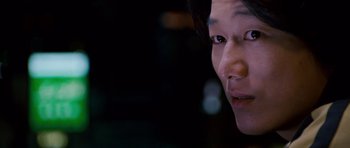 Movie still from “The Fast and the Furious: Tokyo Drift” (2006), directed by Justin Lin – A woman's face in the dark; Close Up shot, Over the shoulder angle