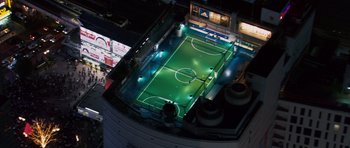 Movie still from “The Fast and the Furious: Tokyo Drift” (2006), directed by Justin Lin – An aerial view of a soccer field at night; Extreme Wide shot, High angle